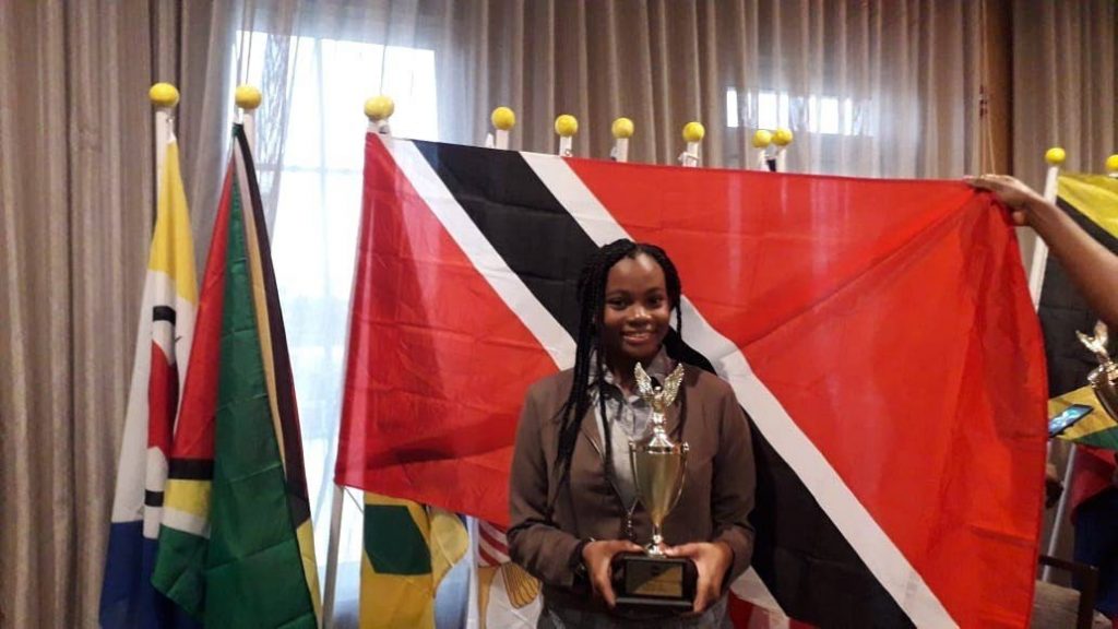 Khalifa Baisden poses with her second place trophy she won at the Toastmasters Regional Competition in Bon Air. 
