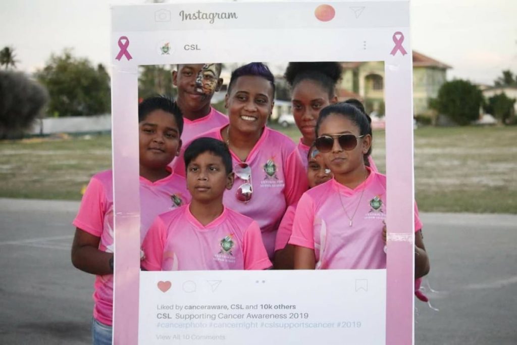 Koriella Espinoza,centre, is all smiles during the Central Super League (CSL) special edition of the Cancer Awareness Day 2019 which was held at the Pierre Road Grounds, Charlieville, on Saturday.