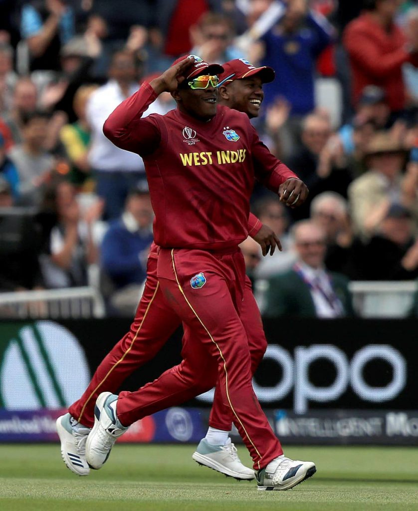 West Indies’ Sheldon Cottrell celebrates after taking a catch to dismiss Australia’s Steve Smith during the teams’ Cricket World Cup match at Trent Bridge, Nottingham, England on Thursday.
 (AP PHOTOS)