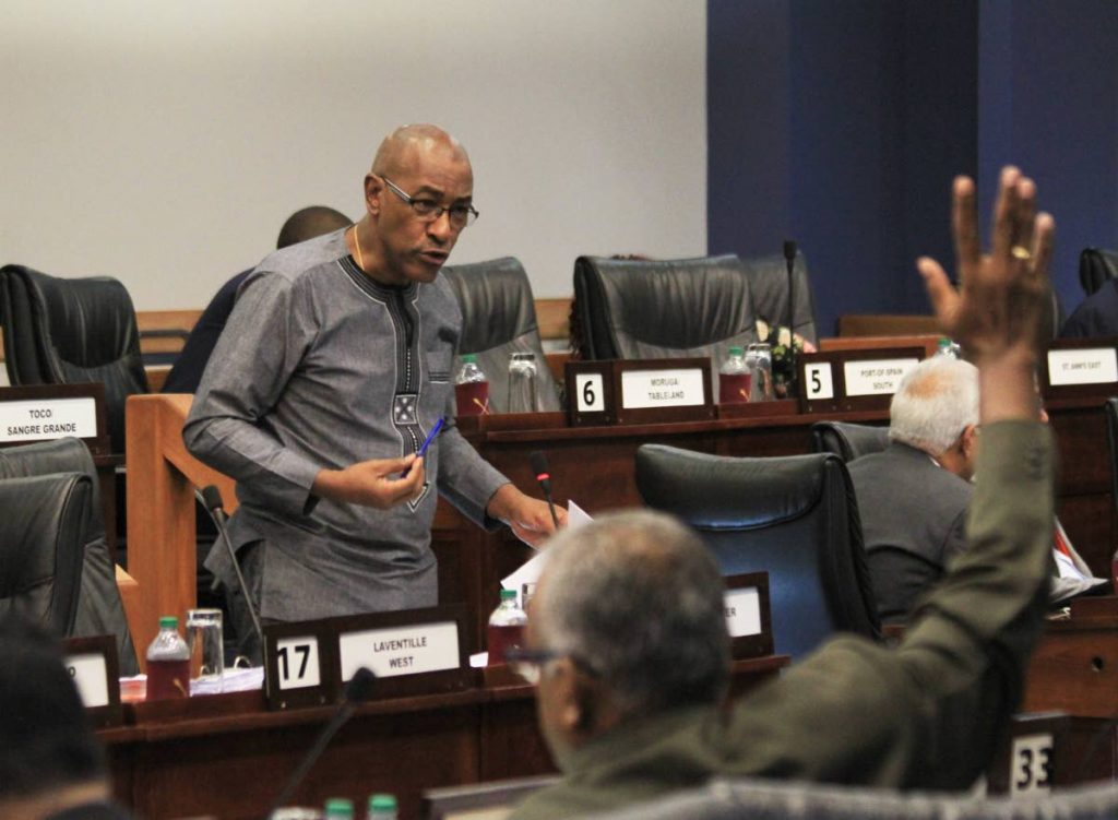 MP for Couva South Rudranath Indarsingh raises his hand to ask a question during Minister of Public Utilities Robert Le Hunte's contribution at Parliament, on Friday afternoon. PHOTO BY AYANNA KINSALE