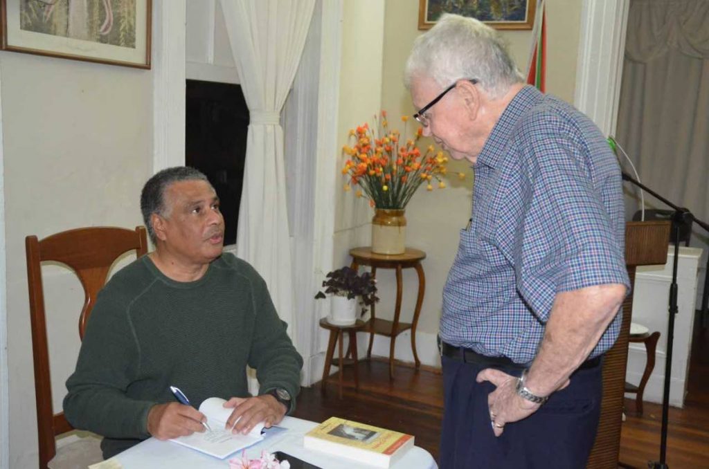  TT poet and journalist Wesley Gibbings in conversation with Trinidad-born Ian McDonald, author of The Humming-Bird Tree, at the launch of Gibbings’ fifth collection of Poetry, Passages, in Guyana on May 3.