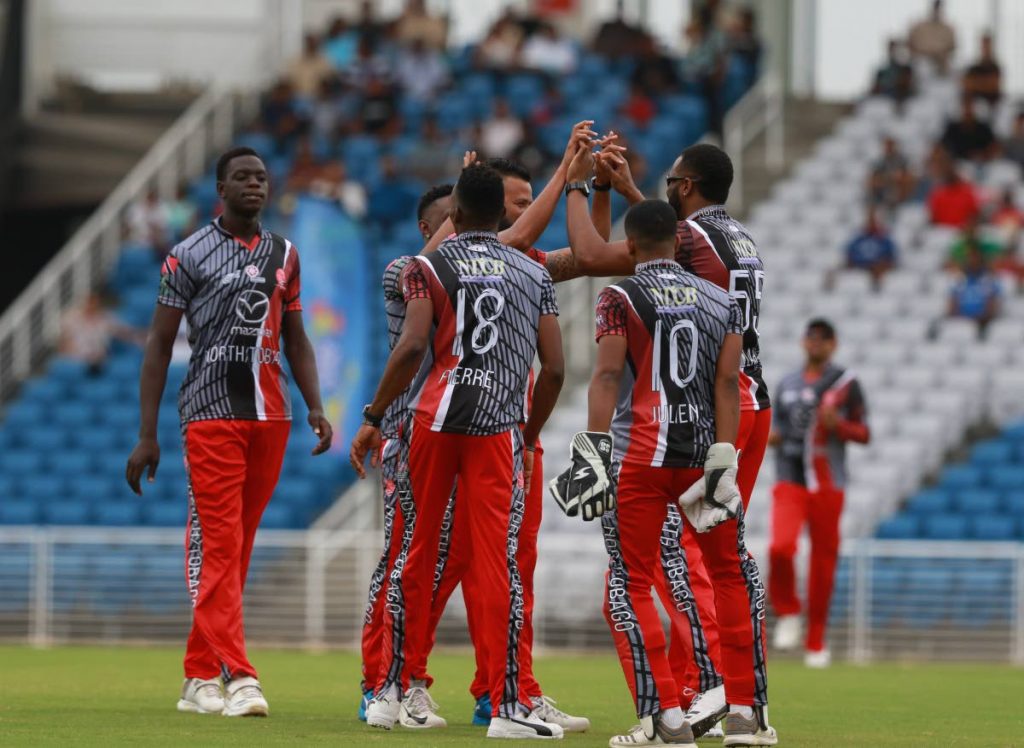 Members of the North/Tobago team celebrate a wicket during the Udecott T10 tournament against the Guyana Jaguars, on Saturday, at the Brian Lara Cricket Academy,Tarouba.