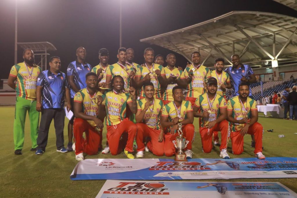 Members of the Guyana Jaguars celebrate winning the Udecott T10 tournament  final against the North/Tobago team, at the Brian Lara Cricket Academy, Tarouba, on Sunday.