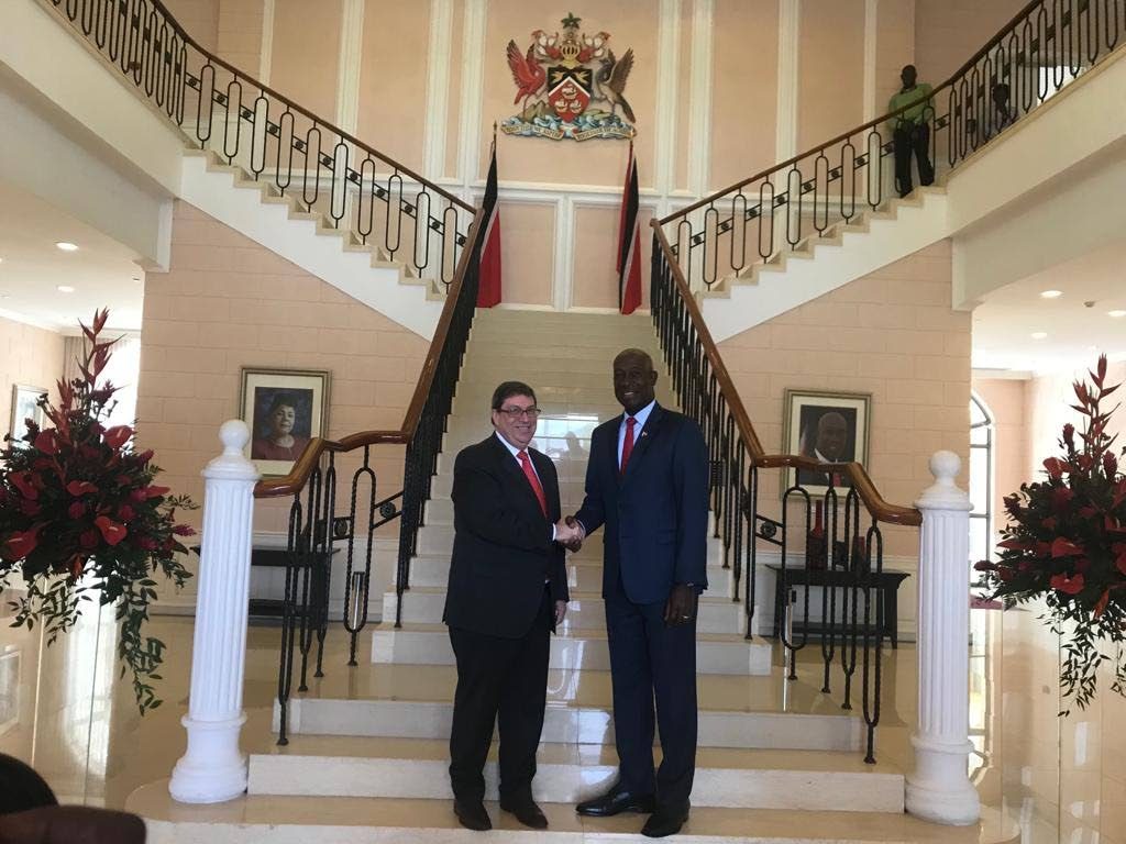 Prime Minister Dr Keith Rowley (right), greets Cuban Foreign Affairs Minister Bruno Rodrigues Parrilla at the Diplomatic Centre. Parrilla paid a courtesy call to the Prime Minister as part of his visit to TT and other Caribbean islands. PHOTO Courtesy Bruno Rodriguez Parrilla on Twitter 