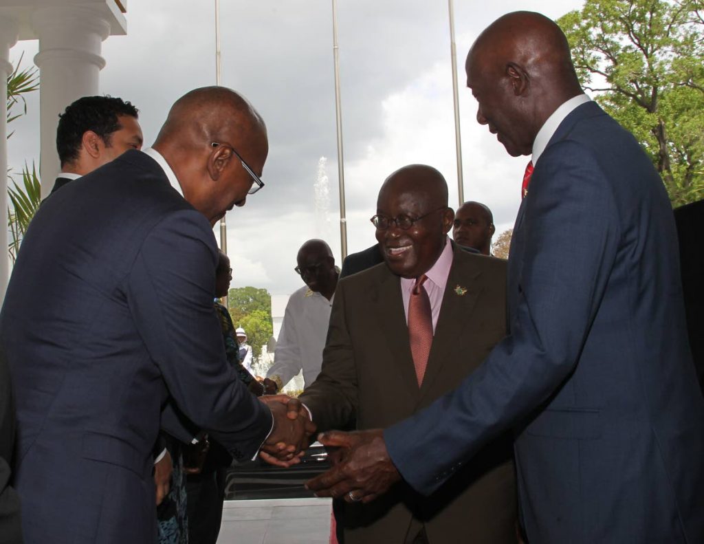Prime Minister Dr Keith Rowley introduces Public Utilities Minister Robert Le Hunte to president of Ghana Nana Akufo-Addo at the Diplomatic Centre, St Ann's on June 13. PHOTO BY ROGER JACOB