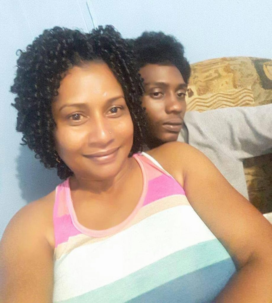 Camille Taitt poses for a selfie with her son Ricardo Dixon who was shot and killed while making his way to work from his home in Carlsen field on Thursday.