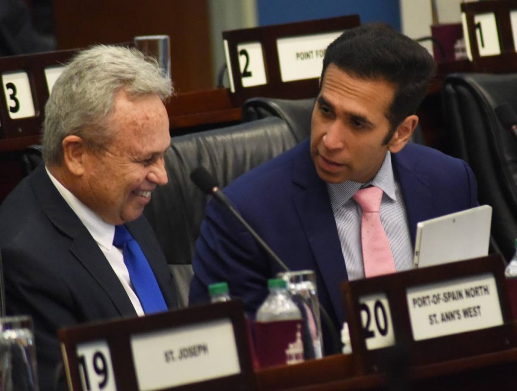 Finance Minister Colm Imbert, left, and Attorney General Faris Al-Rawi during Parliament on Friday. PHOTO BY KERWIN PIERRE