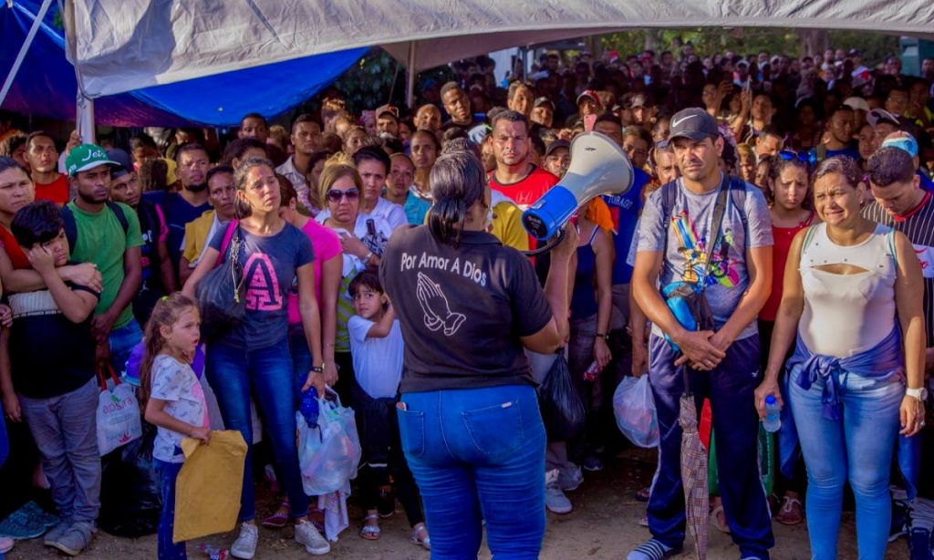 Venezuelans get instructions on the deadline day for registration at Caroline Building in Scarborough last week. PHOTO BY DAVID REID 