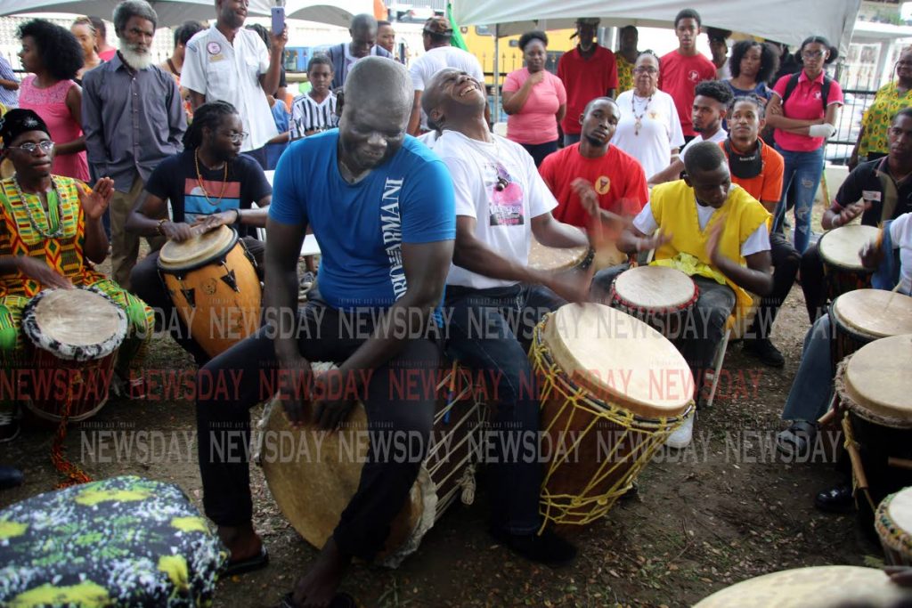 Drummers from different groups perform at the Yoruba Village Drum Festival, Besson Street, Port of Spain yesterday. PHOTO SUREASH CHOLAI
