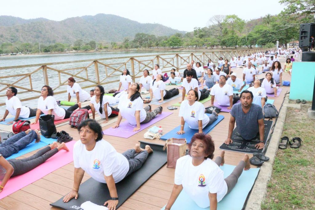 Participants at Yoga Day do their stretches.