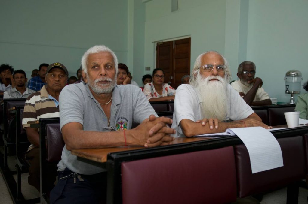 Dairy farmers attend a meeting at the UWI Faculty of Food and Agriculture, St Augustine Campus, to discuss challenges in the dairy industry.
