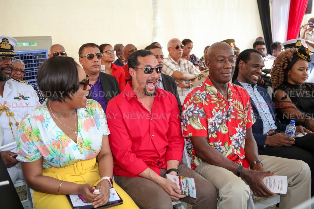 From left: Minister of Sport and Youth Affairs Shamfa Cudjoe, Minister of National Security Stuart Young, Prime Minister Dr Keith Rowley and Minister in the Ministry of the Attorney General Fitzgerald Hinds share a light moment at the opening of the Laventille Community Swimming Pool at Sogren Trace, Laventille, on Sunday. Also in photo are Minister of Culture Nyan Gadsby-Dolly, right, and Commissioner of Police Gary Griffith, second row. PHOTO BY JEFF K MAYERS 