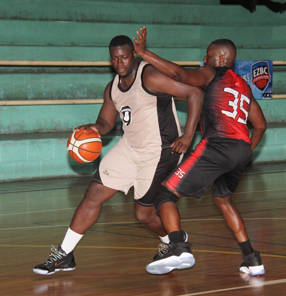 Michael Jerome of Prisons easily dribbles past Terrance Williams of Lawrence Park Lions, in the men’s divsion of the East Zone Basketball Championships, at Maloney Indoor Facilty, on Sunday. PHOTO BY ANGELO MARCELLE