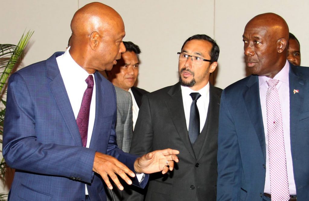 SHELL SHOCKED: Whatever outgoing Shell vice president and country chairman Derek Hudson was saying, he had the undivided attention of Prime Minister Dr Keith Rowley and National Security Minister Stuart Young yesterday at the NGC Shell term sheet signing at the Hyatt Regency in Port of Spain. 