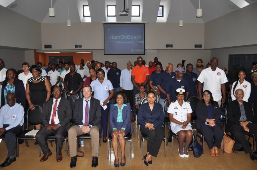 From Left to right: Brent Williams, Senior Legal Officer, Maritime Services Division, Lans Johansen, Deputy Director of ILO, Trade and Industry Minister Paula Gopee-Scoon, and PS in the MOWT Sonia Franis-Yearwood sits among TT seafarers at the Day of Seafarers forum held at the MOWT headquarters in PoS.