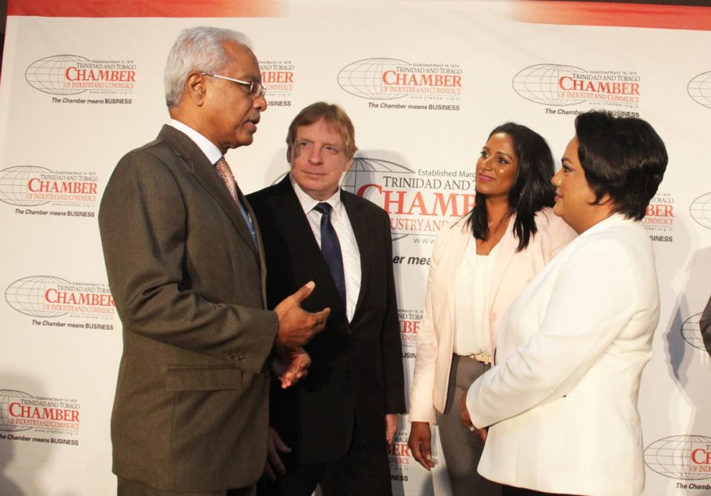 CHAMBER TALKS: From left economist Ronald Ramkissoon, Charles Pashley, Massy Motors CEO Natalie Karamath and Hand Arnold CEO Sharon Gunness-Balkissoon yesterday at the TT Chamber’s Business Outlook forum at MovieTowne, Invader’s Bay. 