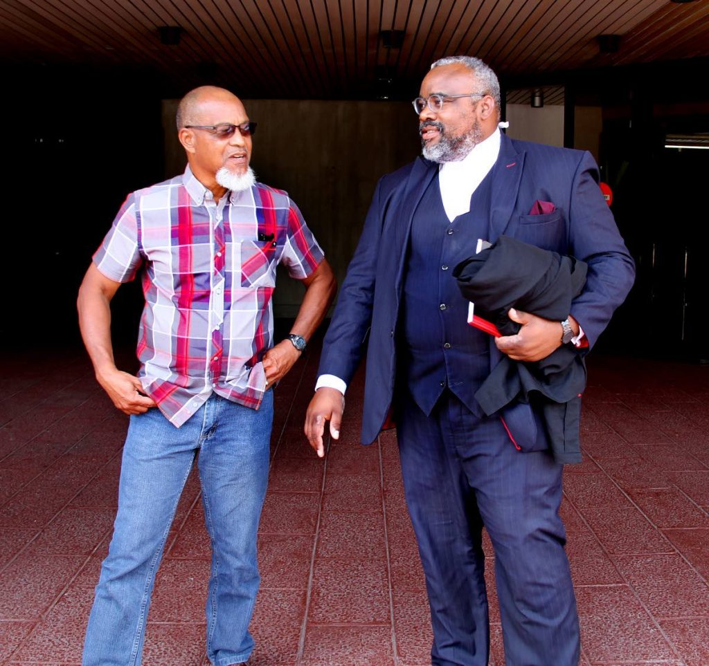 FLASHBACK : In this March 20 file photo, Super League president Keith Look Loy,left, and his attorney Matthew Gayle,chat at the Hall of Justice, Port of Spain, after he scored a victory against the TT Football Association.
