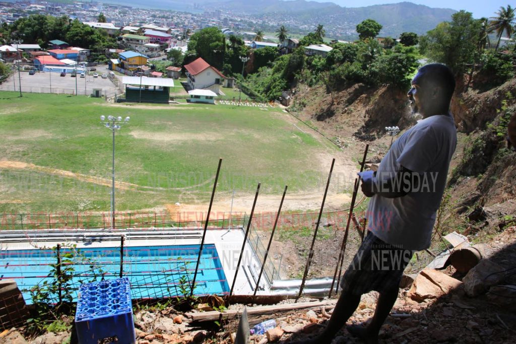 From downstairs of his house a no worried John Stephen looks down at the Laventille Community Swimming Facility at Sogren Trace, off Laventille Road, Laventille. PHOTO SUREASH CHOLAI