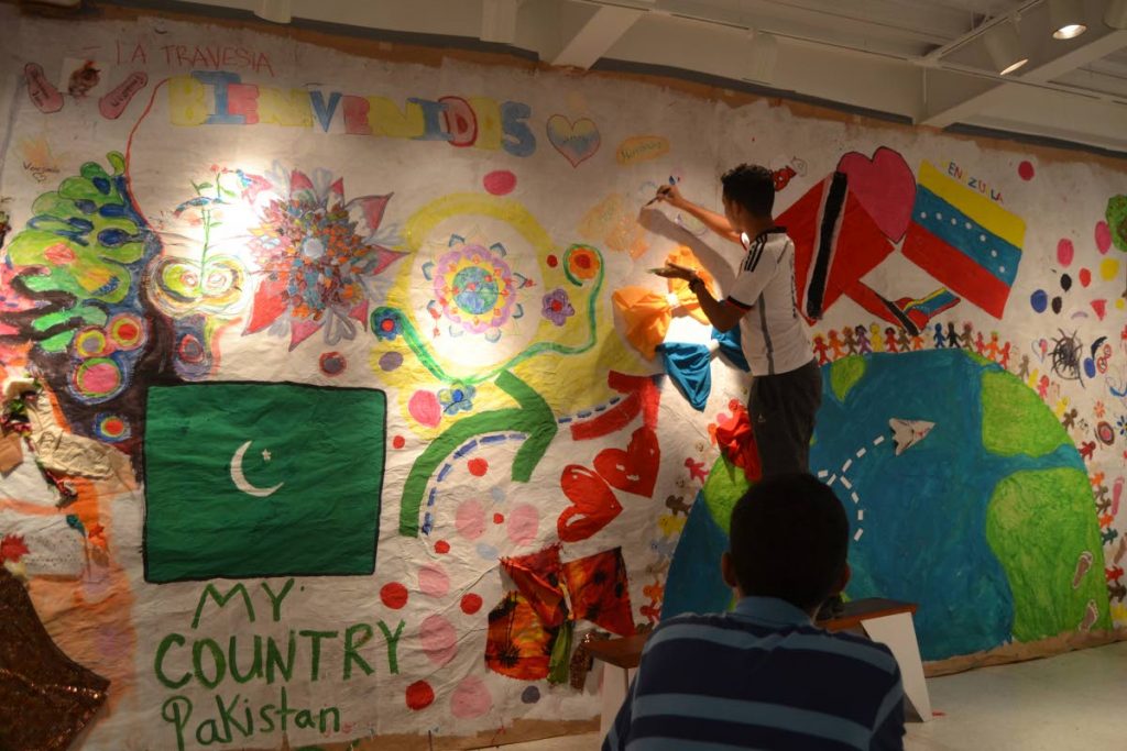 “Children on the move” expressing their feelings about their past, present, and future on one of the murals for In-Between: Stories of a Refugee. PHOTOS COURTESY SATORI HASSANALI