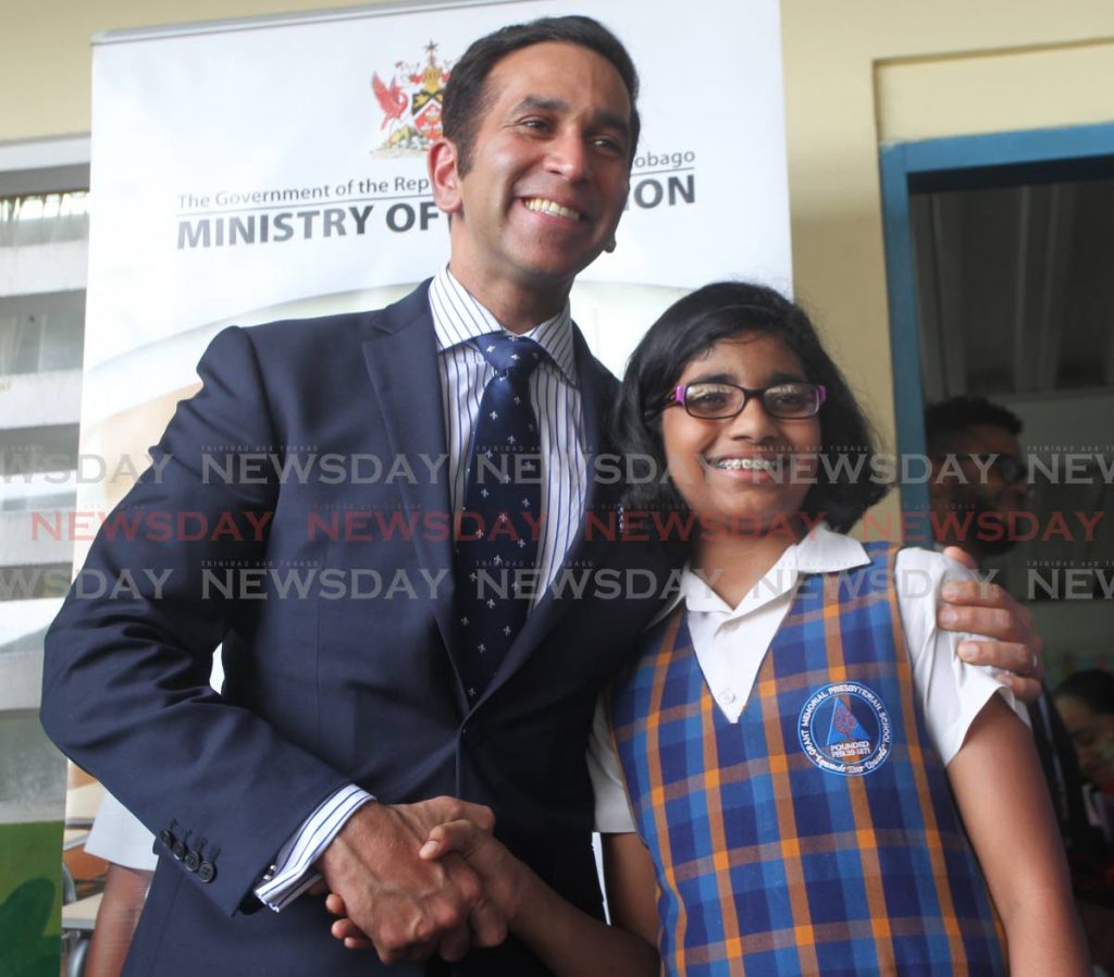 Top SEA student Siri Vadlamudi with San Fernando West MP Faris Al-Rawi after the announcement of results at Grant Memorial Presbyterian School on Friday. PHOTO BY LINCOLN HOLDER             