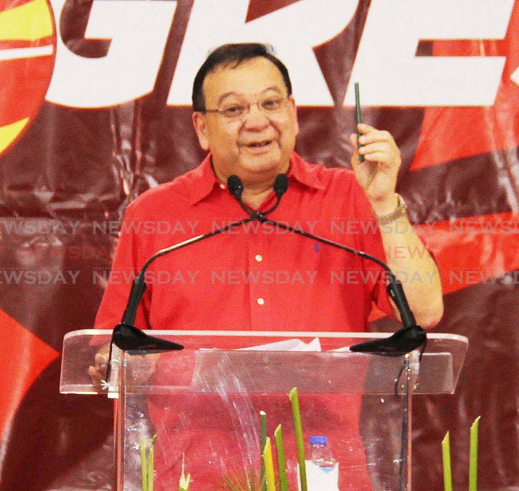 Energy Minister Franklin Khan addresses a PNM public meeting at Point Fortin East Secondary School on last Thursday. PHOTO BY VASHTI SINGH 
