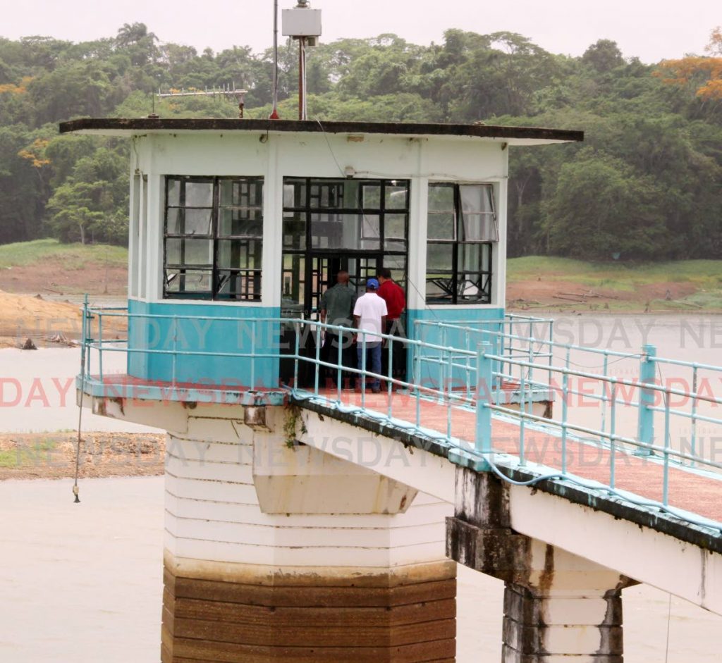 The darker area on the column of a measuring booth at the Navet dam shows where the water level once stood. - File photo