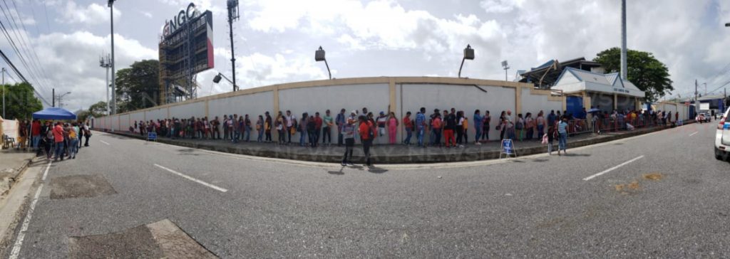 File photo: Venezuelans line up outside the Queen's Park Oval on day five of the Government's registration.


 Photo by James Lanser