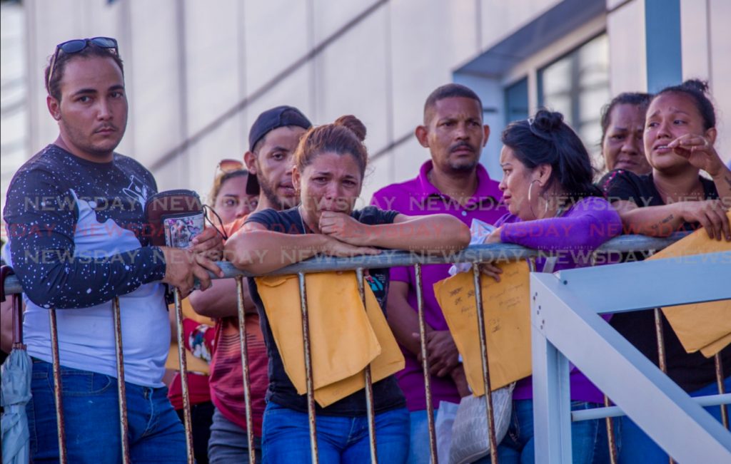 Venezuelans cried when they learned registration was closed off at Caroline Building  Friday. Photo by David Reid