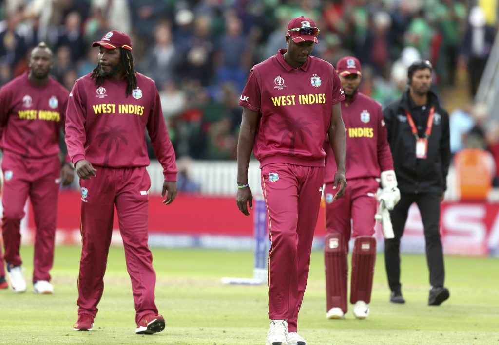 West Indies players walk off dejected after losing the Cricket World Cup match between West Indies and Bangladesh at The Taunton County Ground, Taunton, south west England, Monday June 17, 2019. (David Davies/PA via AP)