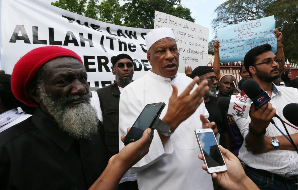 Jamaat Al Muslimeen leader Yasin Abu Bakr and his followers outside the Hall of Justice Port of Spain on April 12, 2018. FILE PHOTO