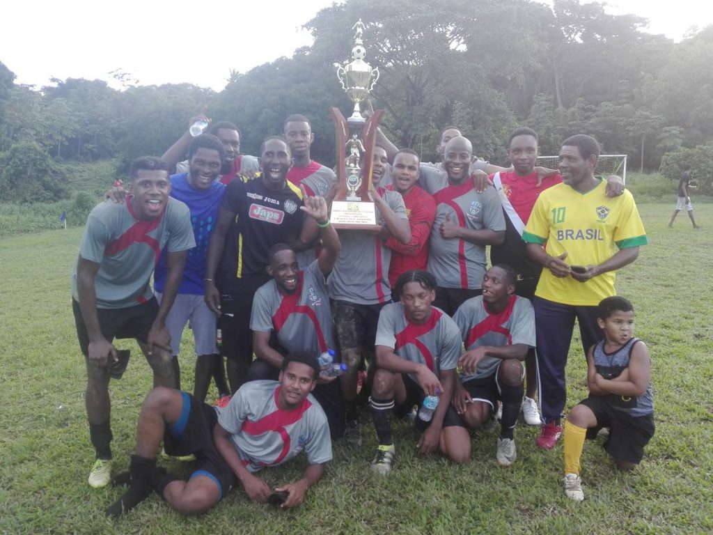 Gremio team-mates celebrate their 3-2 vicotry over Boys Town in the 2018 Caribbean Welders Fishing Pond Football League final at the Fishing Pond Recreation Ground.