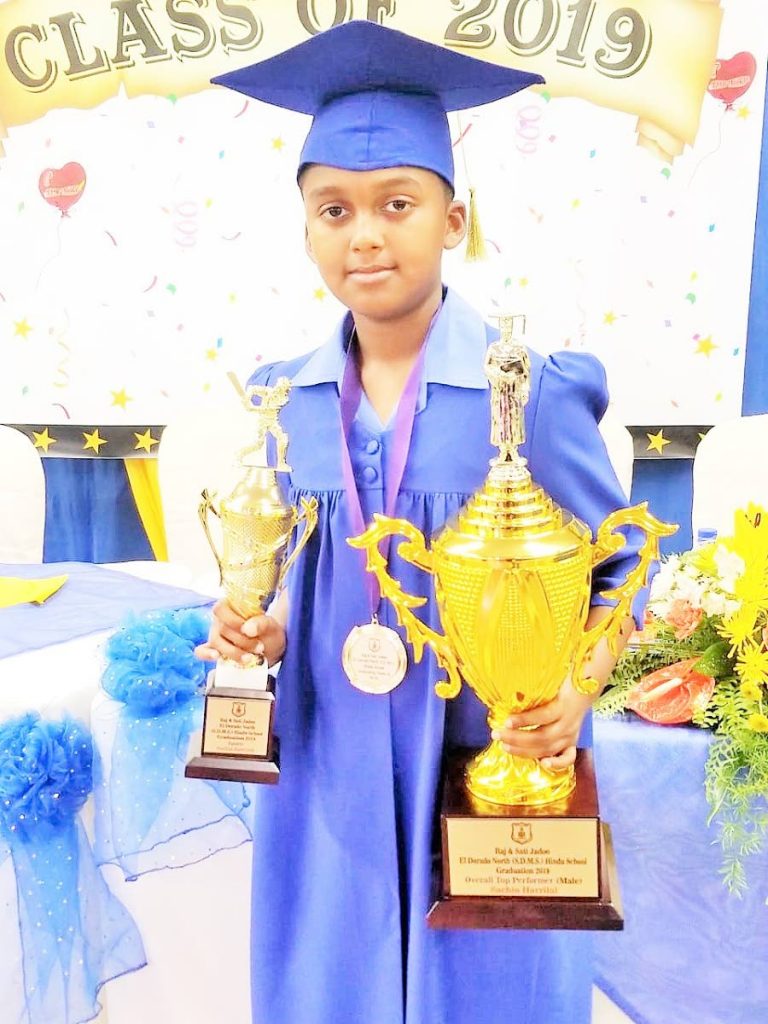 Sachin Harrylal with his awards for top overall student during El Dorado North Hindu School's graduation on June 15.