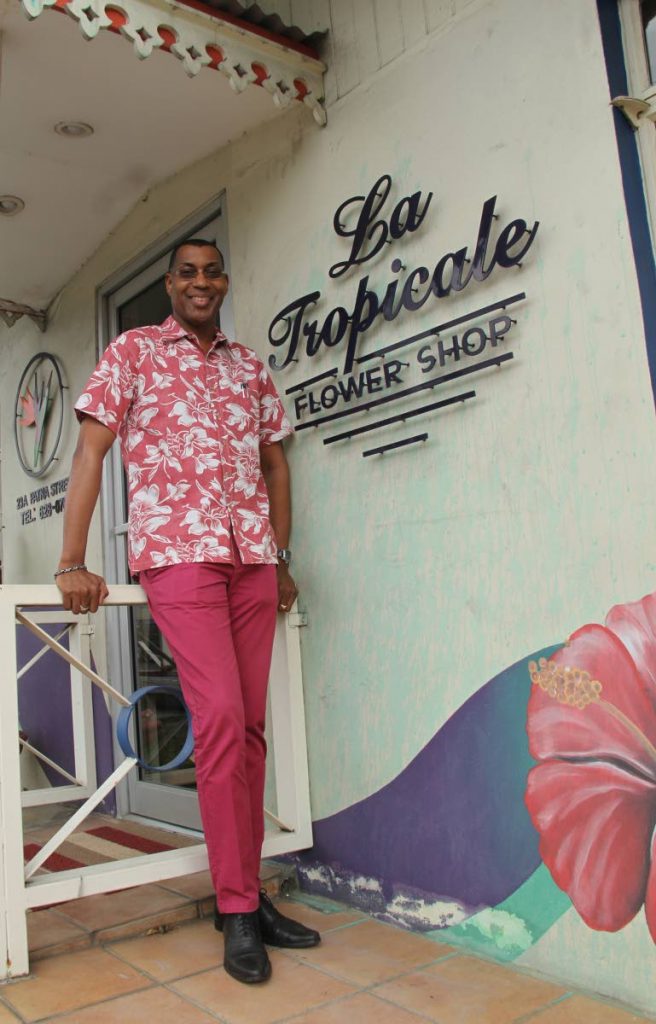 Bernard Beckles stands outside of his flower shop, La Tropicale. It  has been in business since 1988. 
