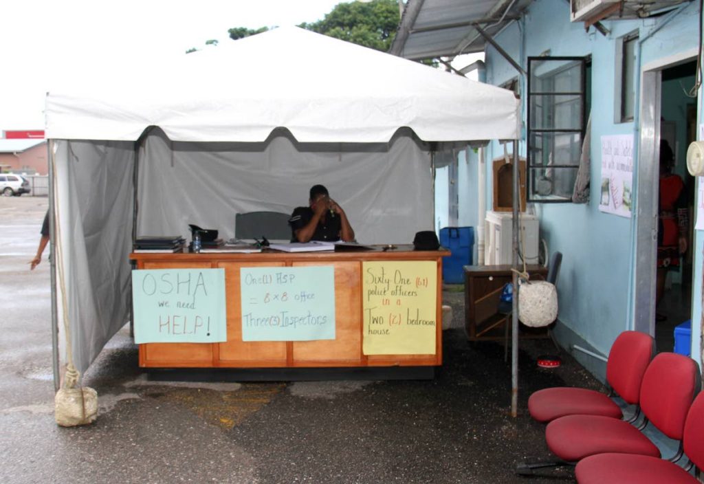 UNDER A TENT: The charge room of the Arima Municipal police is under a tent.
