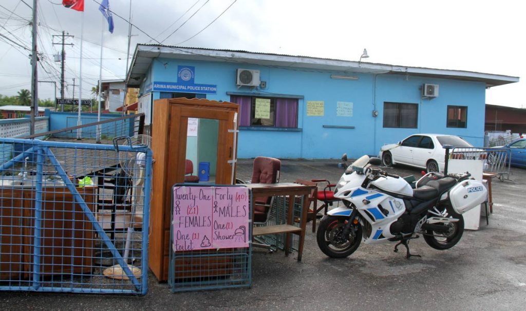 Equipment and furniture placed in the yard of the Arima Municpal Police compound last Friday as the officers complained about the condition of the building.