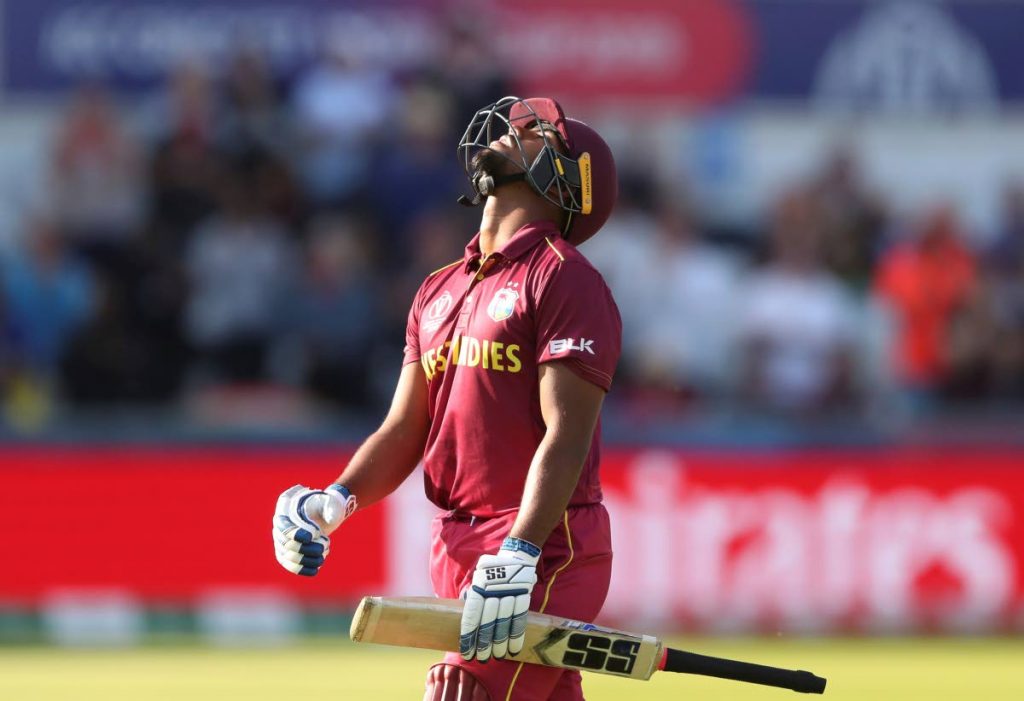 West Indies' batsman Nicholas Pooran reacts as he leaves the crease after being dismissed by Sri Lanka's Angelo Mathews yesterday. (AP PHOTO) 