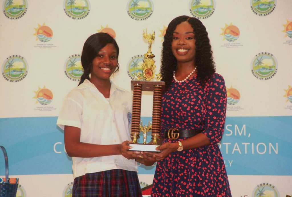 Newly appointed Junior Secretary of Tourism Kayleigh Lewis as she recently received the Tourism Youth Congress challenge trophy from Secretary of Tourism, Culture and Transportation, Councillor Nadine Stewart-Phillips. 
FILE PHOTO