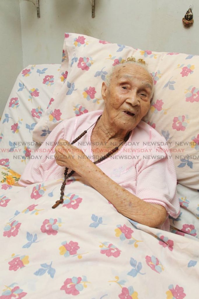Lorencia Locario, who celebrated her 101st birthday on Thursday, speaks to Newsday about her life expriences at her home in Pipiol Village, Santa Cruz, on Thursday. PHOTO BY ROGER JACOB