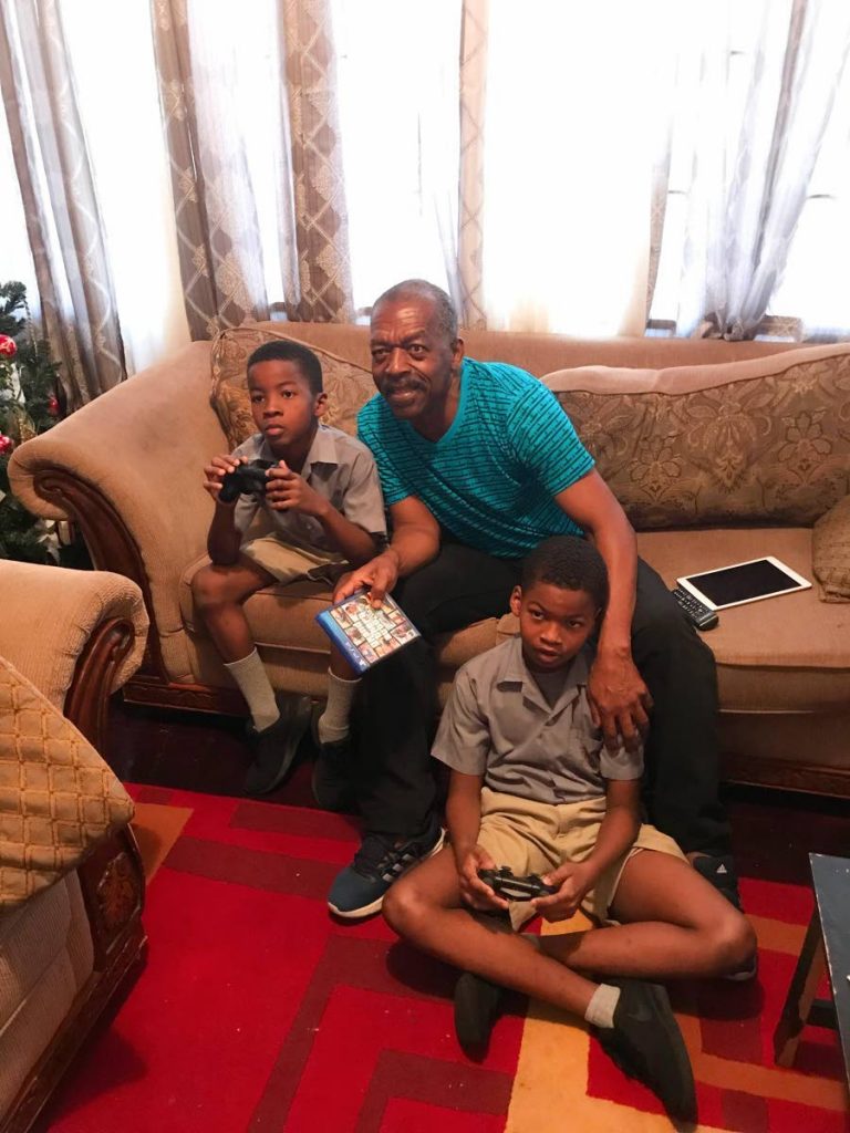 GB and his grandsons enjoy a movie at his home last year. GB lost all his possessions in a fire on July 1.