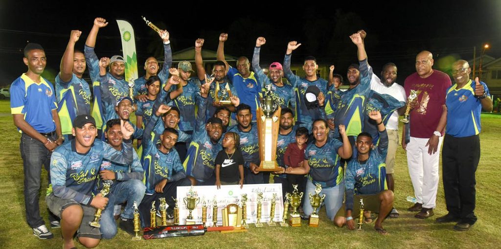 Royal Strikers and their supporters celebrate their double crown in the 2019 BPTT Mayaro Night Windball Cricket League last Saturday. Sharing in the excitement are Matthew Pierre (second from right), community liaison officer, BPTT; Bunny Lynch (right), president, All-Mayaro Sports Foundation (AMSF); and Jameson Rigues (left), corporate secretary, AMSF.