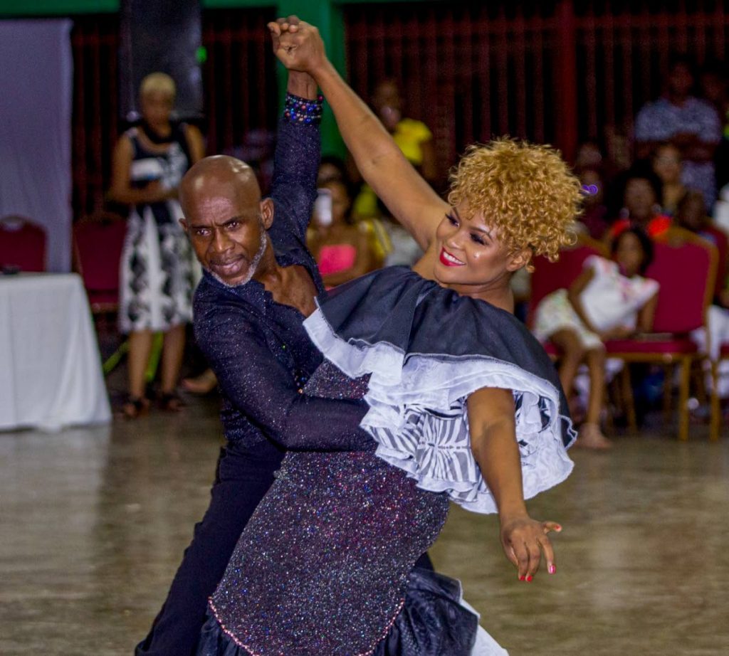 Culture Minister Dr Nyan Gadsby-Dolly, right, on her way to victory in the 2019 Dancing with Caribbean Stars competition, alongside her partner Francis Stanislaus, at the Signal Hill Secondary School on Saturday.  PHOTO BY DAVID REID 