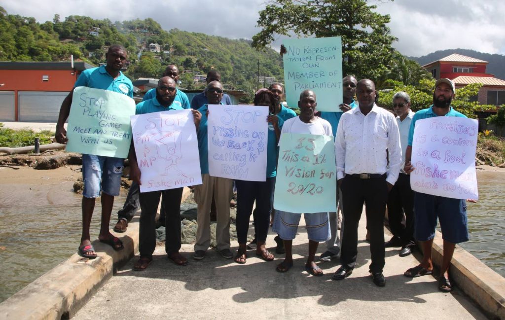 Fishermen from the Carenage Fishing centre, hold a protest about poor conditions there yesterday.
