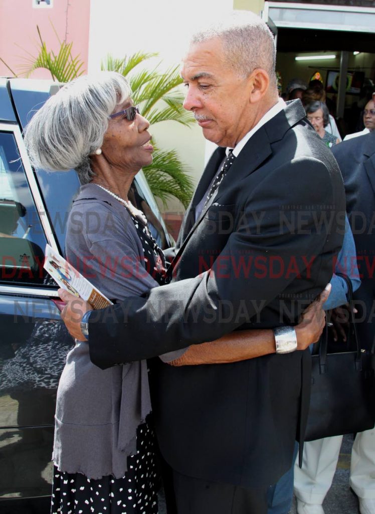 Former President, Anthony Carmona, embraced by Janet Blackman, mother of Lewin Dirk Blackman, Butler to the President of Trinidad and Tobago, Holy Saviour Anglican Church, Curepe. PHOTO BY ROGER JACOB.
