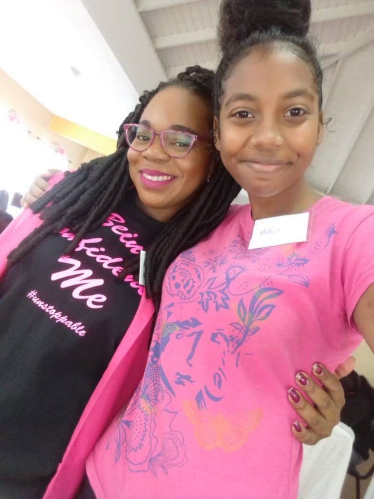 Rinisse Walker, founder of HeartSpeakz International Mentoring and Literacy Academy and student Melys Phillip.