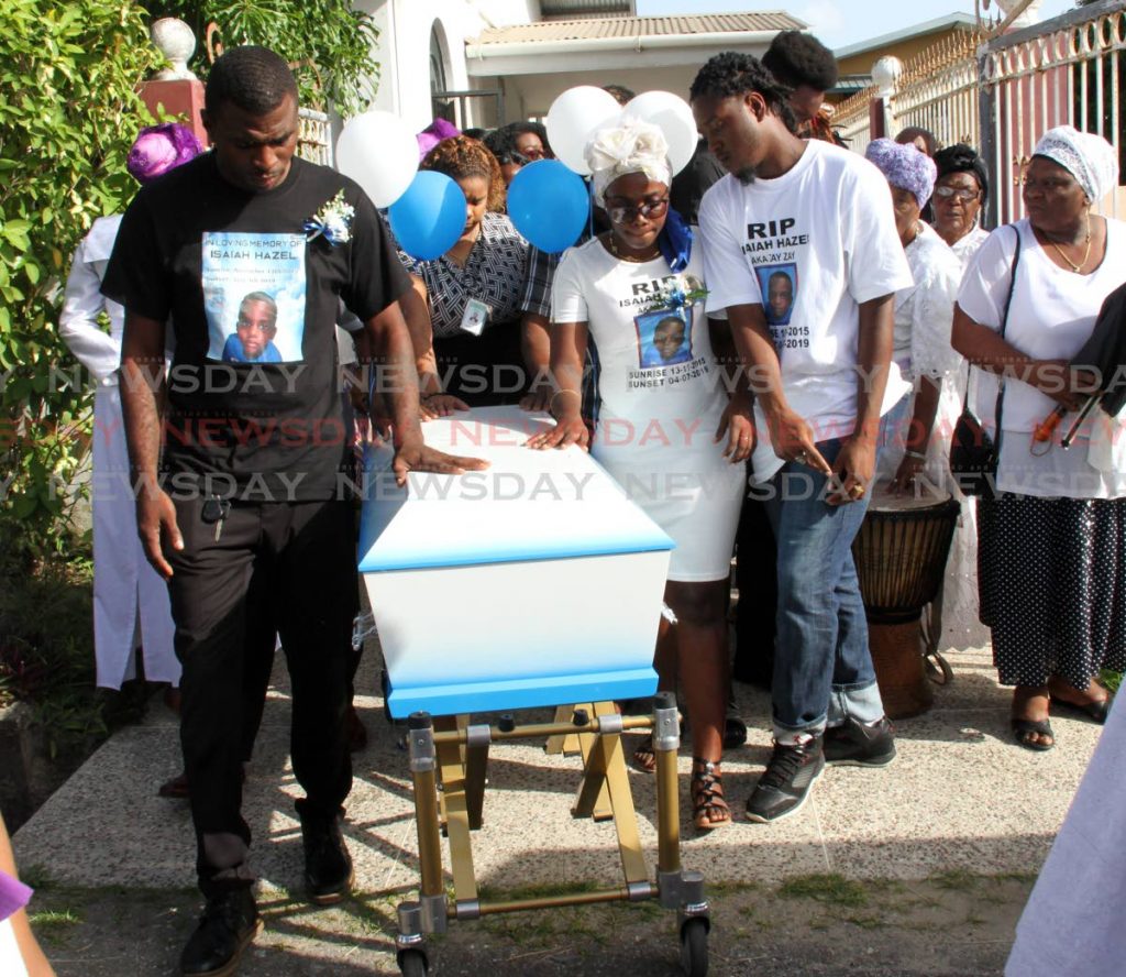 Kendel Hazel, left, and Amanda Vincent, parents of Isaiah Hazel were pall bearers at the funeral of their son at Mt. Moriah Spiritual Baptist Church, Yallery Street, Couva, on Wednesday. PHOTO BY VASHTI SINGH