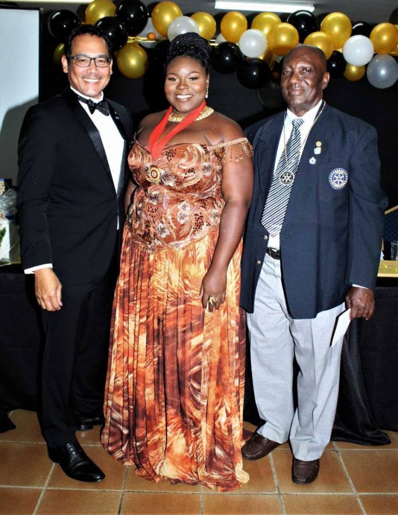 Assistant district governor Gary Williams, left, with presidents Luynda Ashby and Patrick Godson Phillip.