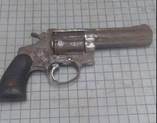 A .357 revolver was confiscated at an abandoned lot in Dow Village, Couva by members of the IATF.  PHOTO COURTESY THE TTPS