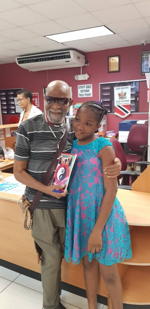 Bill Trotman presents an autographed copy of his book of poems to a youth at the  library.

 Bill Trotman presents an autographed copy of his book of poems to a youth at the  library.

 

 



 

