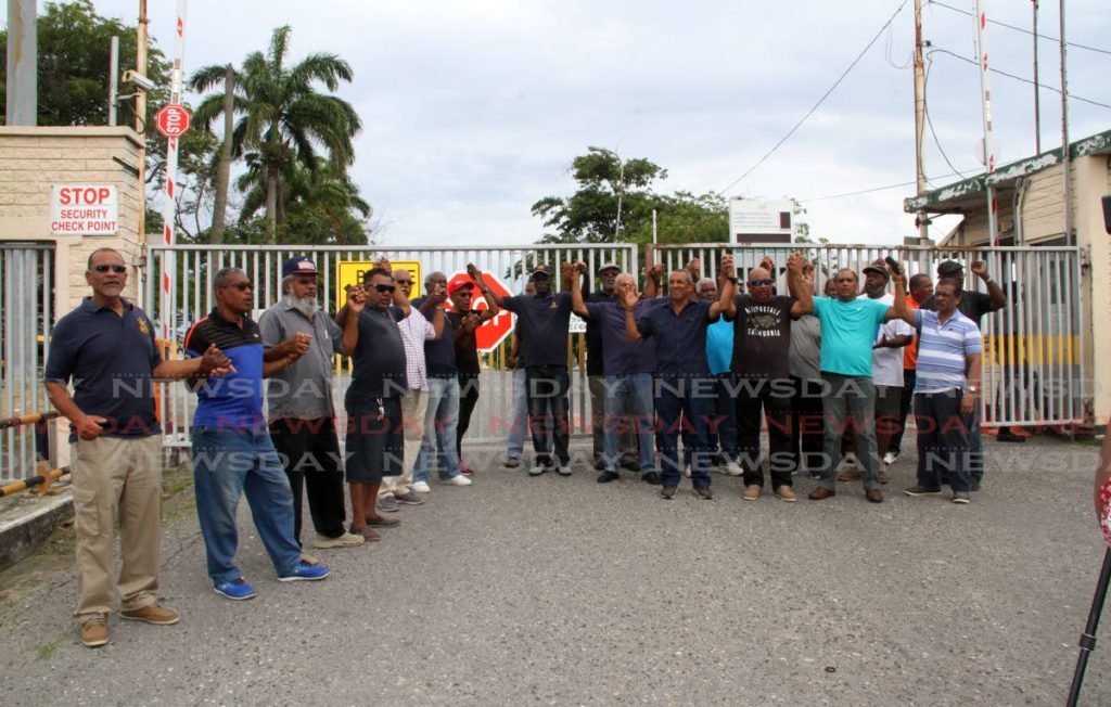 Petrotrin retirees protest at Petrotrin’s Pointe-a-Pierre main administration building yesterday. PHOTO BY VASHTI SINGH