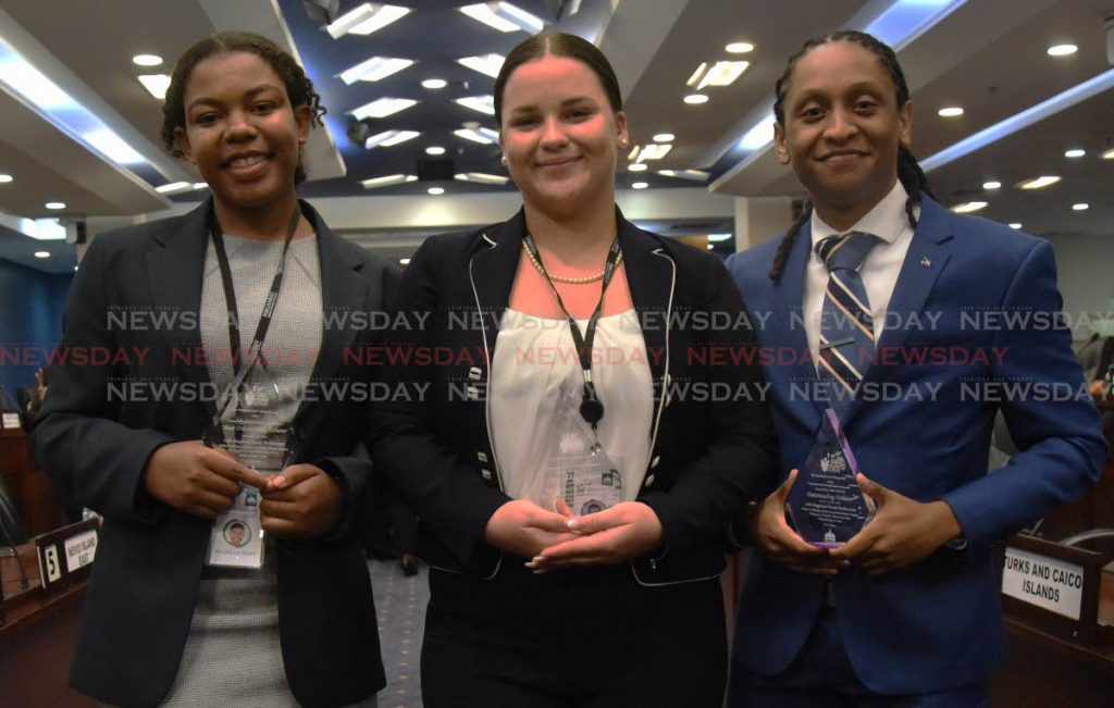 Winners of 15th Regional Youth Parliamentary Debate, from left, minister of rural development and local government, Halle Teart member for Bermuda; minister of works and transport India Wells, member for the Commonwealth of Bahamas; and opposition member Jayson Braynen, member for the Commonwealth of Bahams after receiving their awards at the 15th Regional Youth Parliamentary Debate at Parliament in Port of Spain, on Wednesday. PHOTO BY KERWIN PIERRE
